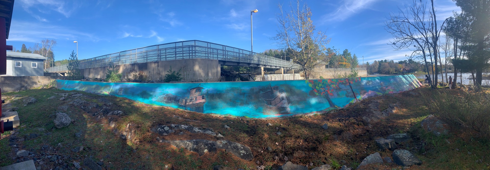 blue mural that contains lighthouses and trees