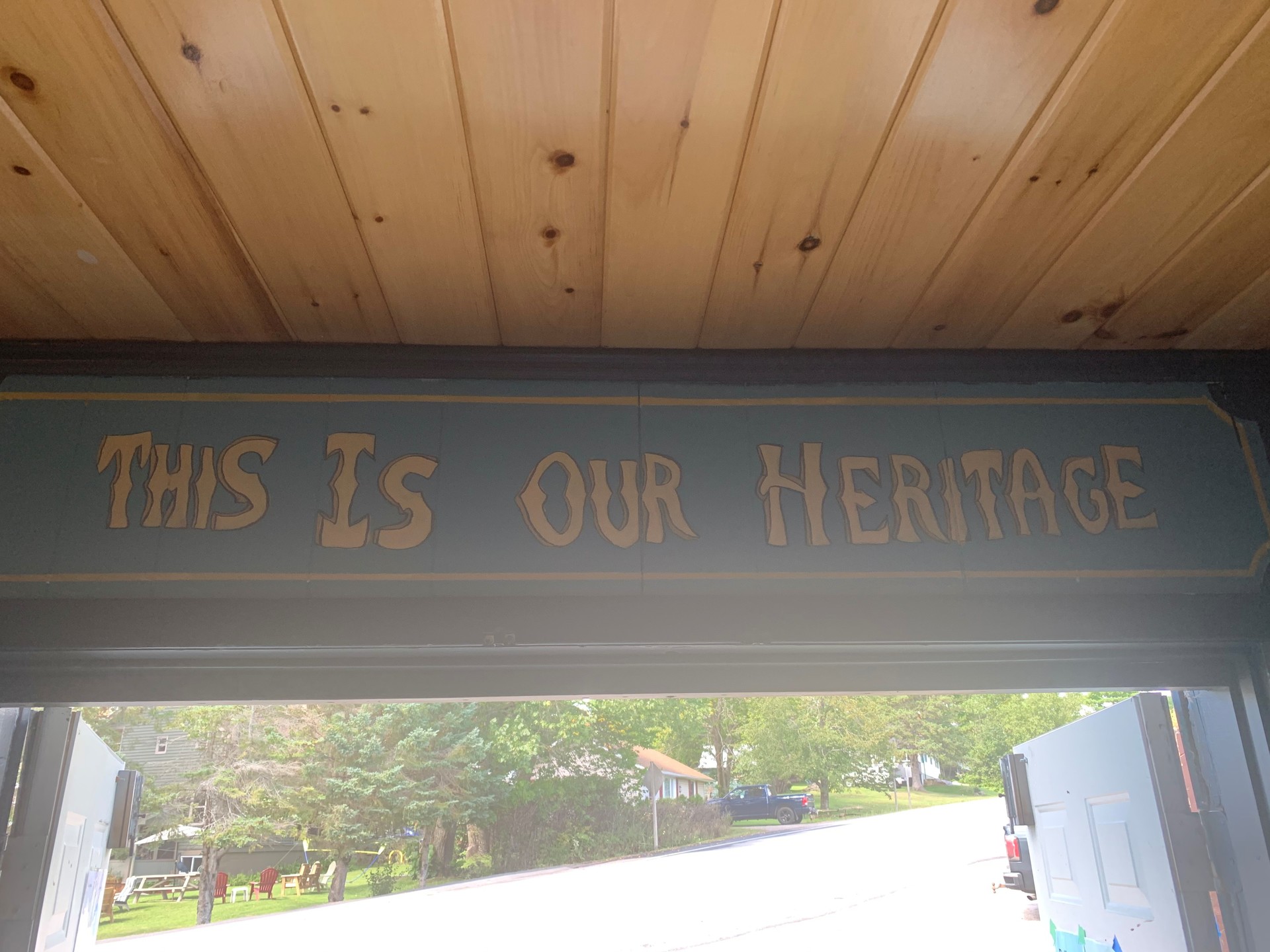 this is our heritage painted above a doorway